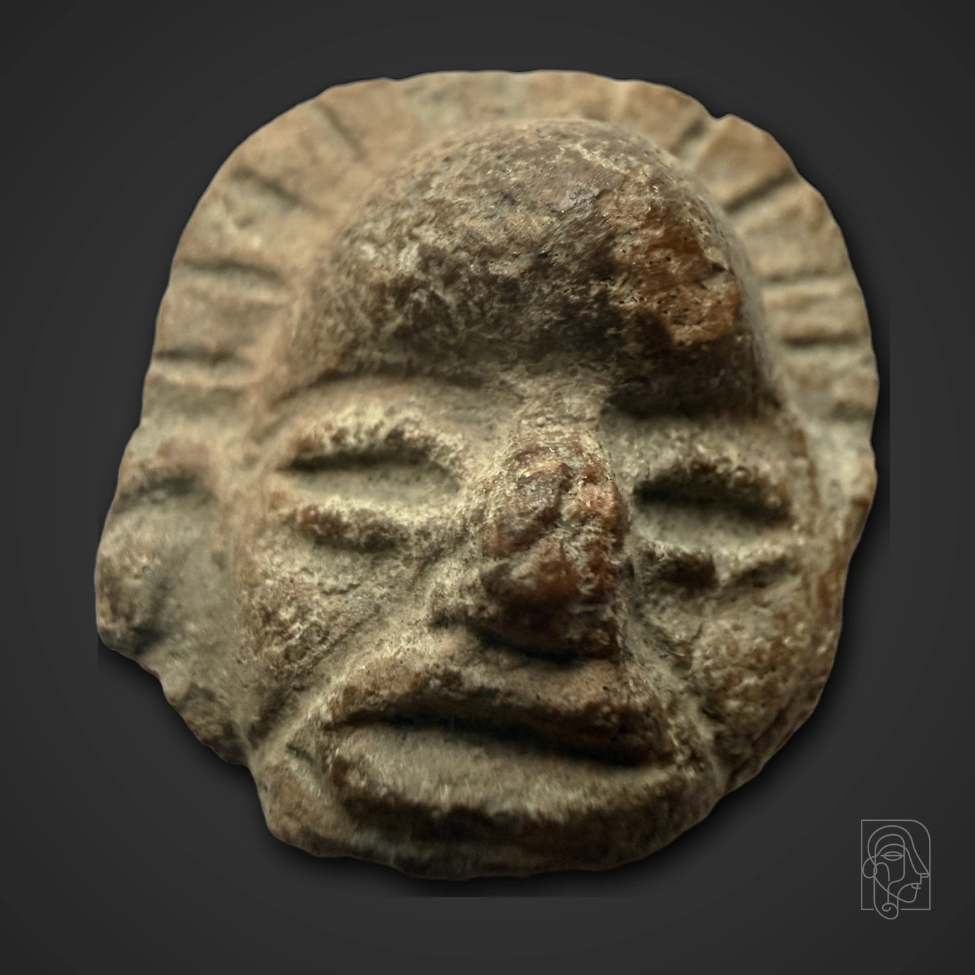 Terracotta Head with Radially Incised Flaring Headdress